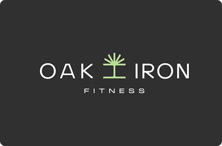 Logo of "Oak Iron Fitness" on a dark background. The text is white, with a green tree symbol between "Oak" and "Iron," conveying strength and growth.